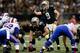 Drew Brees makes his checks against the Bills.