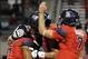 Nov 9, 2013; Tucson, AZ, USA; Arizona Wildcats receiver Nate Phillips (6) gets congratulated by offensive lineman Lene Maiava (77) and quarterback B.J. Denker (7) after scoring a touchdown against the UCLA Bruins during the fourth quarter at Arizona Stadi