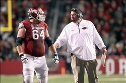 Head coach Bret Bielema (right) and C Travis Swanson