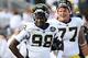 #98 Devin Gardner and #77 Taylor Lewan