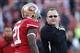 Offensive coordinator Greg Roman talks with Frank Gore