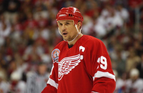 Detroit Red Wings captain Steve Yzerman (19) passes the puck to