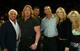 Triple H and Batista during Evolution's glory days. Ric Flair, Randy Orton, Stacy Keibler and Jackie Gayda also feature in the photo.