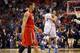 UCLA's Kyle Anderson and Travis Wear celebrate beating Arizona in last year's Pac-12 tournament while Wildcat guard Nick Johnson walks by