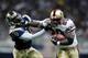 Garrison Hearst utilized a lethal stiff arm during his playing days with the 49ers.