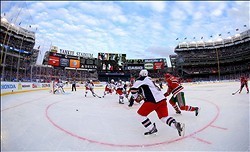 The New Jersey Devils work on a drill during outdoor hockey practice for  the NHL Stadium Series Saturday, Jan. 25, 2014, at Yankee Stadium in New  York. The Devils take on the