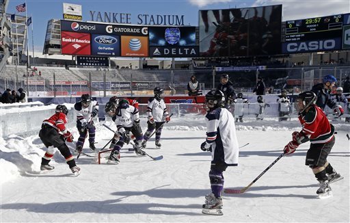 Rangers beat Devils 7-3 during snowy outdoor game at Yankee