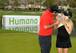 Patrick Reed and wife share a kiss with the winner's trophy at the Humana Challenge.