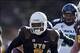Nov 23, 2013; Laramie, WY, USA; Wyoming Cowboys wide receiver Robert Herron (6) runs for a touchdown against the Hawaii Warriors during the second quarter at War Memorial Stadium. The Cowboys defeated the Warriors 59-56 in overtime. Mandatory Credit: Troy