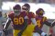 Southern California defensive end George Uko, top, steps over Utah State quarterback Chuckie Keeton after sacking him during the second half of an NCAA college football game on Saturday, Sept. 21, 2013, in Los Angeles. (AP Photo/Mark J. Terrill)