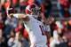 Alabama quarterback AJ McCarron (10) throws prior to the start of an NCAA college football game against Auburn in Auburn, Ala., Saturday, Nov. 30, 2013. (AP Photo/Dave Martin)