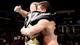 The Rhodes brothers embrace in a hug after defeating Curtis Axel and Ryback.