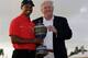 Tiger Woods won the 2013 WGC-Cadillac and received the trophy from Donald Trump.