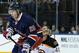 New York Rangers' Chris Kreider, left, jumps up in front of Boston Bruins goalie Tuukka Rask during the second period of an NHL hockey game Sunday, March 2, 2014, in New York. (AP Photo/Seth Wenig)
