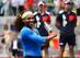 Serena Williams holds the trophy for the Madrid Open like it's a self-defense weapon.