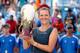 Victoria Azarenka holds the trophy at Cincinnati 2013.