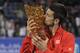 Novak Djokovic with the trophy from Mubadala exhibition.