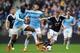 Steven Davis of Southampton under pressure from Manchester City's Yaya Toure and Pablo Zabaleta in their Premier League tie.