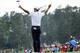 Adam Scott strikes the pose Sunday afternoon that he did last year when he won the 2013 Masters.