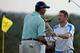 Matt Kuchar and Jonas Blixt end their rounds with a handshake.