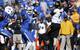 Kentucky DL Alvin "Bud" Dupree (center)