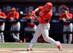 Oscar Taveras gets a hit in a Spring Training game against the Mets on March 7.