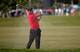 The grimace on Tiger Woods' face tells it all.