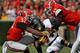 Georgia LB Amarlo Herrera (52) and DE Ray Drew