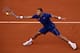 Jo-Wilfried Tsonga slides toward the ball during his first-round match at the 2014 French Open.