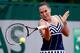 Jelena Jankovic hits a forehand in her opening-round match at the 2014 French Open.