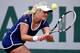Aleksandra Wozniak goes for her backhand during a match at the 2014 French Open.
