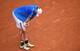 John Isner takes a breather during his third-round match at the 2014 French Open.