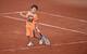 Leon Zimonjic plays on clay courts at Roland Garros following his father's doubles match.