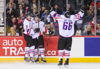 Perlini (No. 11, far left) celebrates with fellow teammates at the CHL Top Prospects game in January.