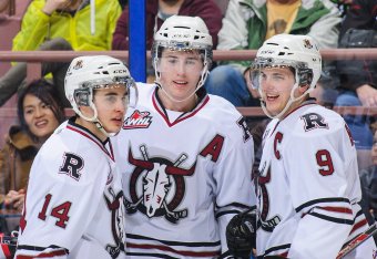 Fleury ("A", center) celebrates a goal with teammates in a CHL game.