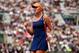 Kristina Mladenovic celebrates winning a point during a match at the 2014 French Open.