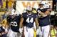 Reese Dismukes and Chad Slade with Cameron Artis-Payne