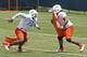 Ja'Wuan James works out during OTAs.