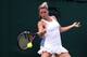 Camila Giorgi wears a lace laden skirt at the 2014 Championships, Wimbledon.