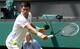 Novak Djokovic steadies his racket to hit a backhand during a third-round match at Wimbledon.