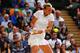 Petro Kvitova hits a backhand during her third-round match at Wimbledon, 2014.