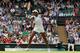 Venus Williams hits a volley during her third-round match at Wimbledon, 2014.