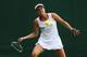Jana Cepelova focuses on the ball during her first-round match at Wimbledon, 2014.