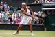 Heather Watson goes for a backhand during her second-round match at Wimbledon.