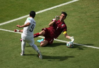 Gigi Buffon denies Luis Suarez in the first half of Italy's clash with Uruguay.