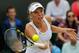 Caroline Wozniacki attempts a volley during her second-round match at Wimbledon.