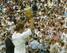 Federer wins his first career Grand Slam at Wimbledon. in 2003