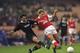 A very old photo of Hubert Fournier in his playing days tackling Paul Merson.