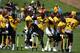 Linebackers and cornerbacks spent time stretching using hurdles.