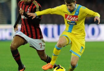 Jorginho battles Robinho during Napoli's 3-1 victory over Milan.